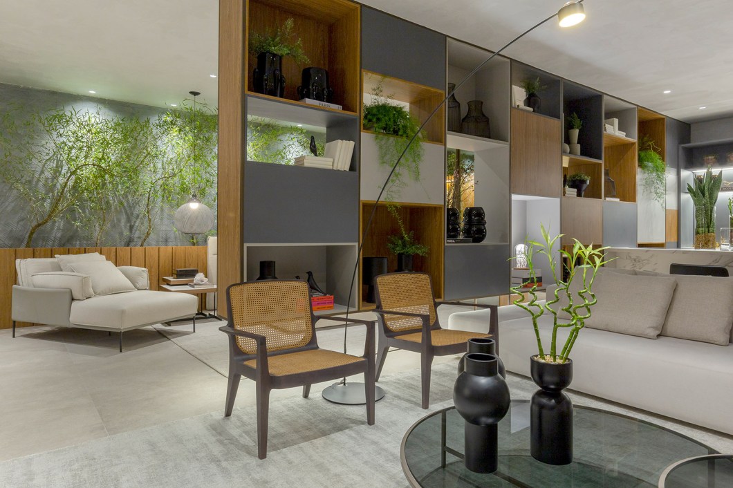 Natalia Veloso - Loft Origami. Inspirado na arquitetura minimalista japonesa, que propõe a valorização do essencial e a diminuição do ritmo de vida, o ambiente de 90 m² mescla materiais nobres e atemporais e um mobiliário contemporâneo com peças assinadas pelo designer Jader Almeida. Uma estante suspensa de 7,5 m se apresenta como a grande protagonista. O conceito aberto do loft aparece na concepção do espaço da casa como um verdadeiro refúgio e uma espécie de oásis urbano. Natalia Veloso - Loft Origami. Inspirado na arquitetura minimalista japonesa, que propõe a valorização do essencial e a diminuição do ritmo de vida, o ambiente de 90 m² mescla materiais nobres e atemporais e um mobiliário contemporâneo com peças assinadas pelo designer Jader Almeida. Uma estante suspensa de 7,5 m se apresenta como a grande protagonista. O conceito aberto do loft aparece na concepção do espaço da casa como um verdadeiro refúgio e uma espécie de oásis urbano.